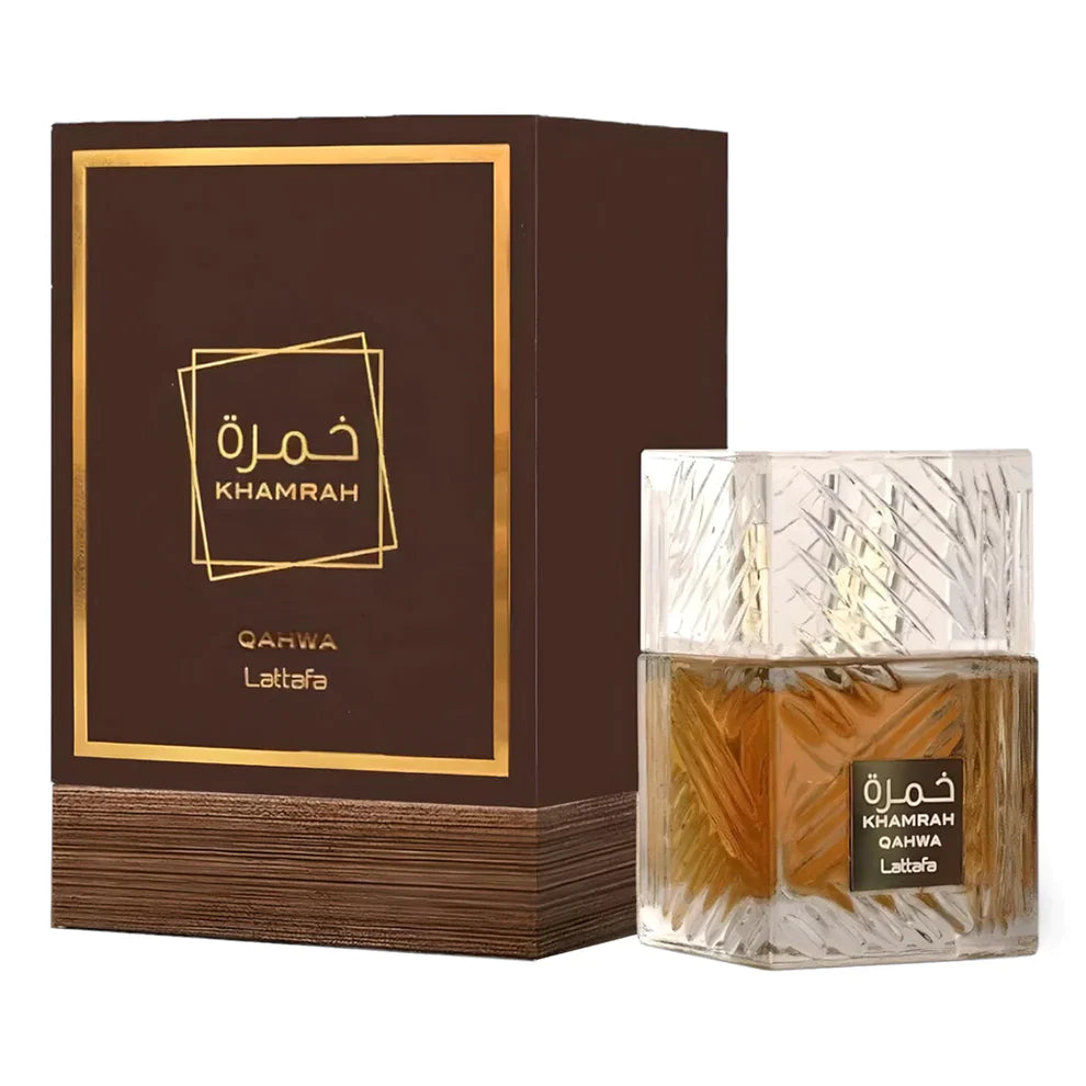 A perfume bottle with a brown liquid and a geometric pattern on the glass, next to its packaging box which has 'KHAMRAH QAHWA Lattafa' written on it.