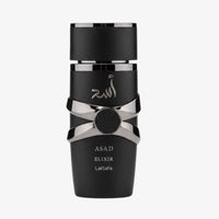 Black and silver perfume bottle labeled 'Asad Elixir' by Lattafa on a white background