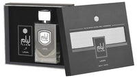 A perfume bottle with a gray label and cap, next to its packaging box with a transparent window displaying the product.