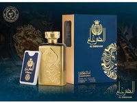 A gold-colored perfume bottle with intricate designs, accompanied by a blue and gold box with matching design elements and a card.
