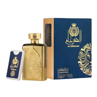 A gold-colored perfume bottle with intricate designs, accompanied by a blue and gold box with matching design elements and a card.