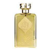 A gold-colored perfume bottle with intricate designs, accompanied by a blue and gold box with matching design elements and a card.